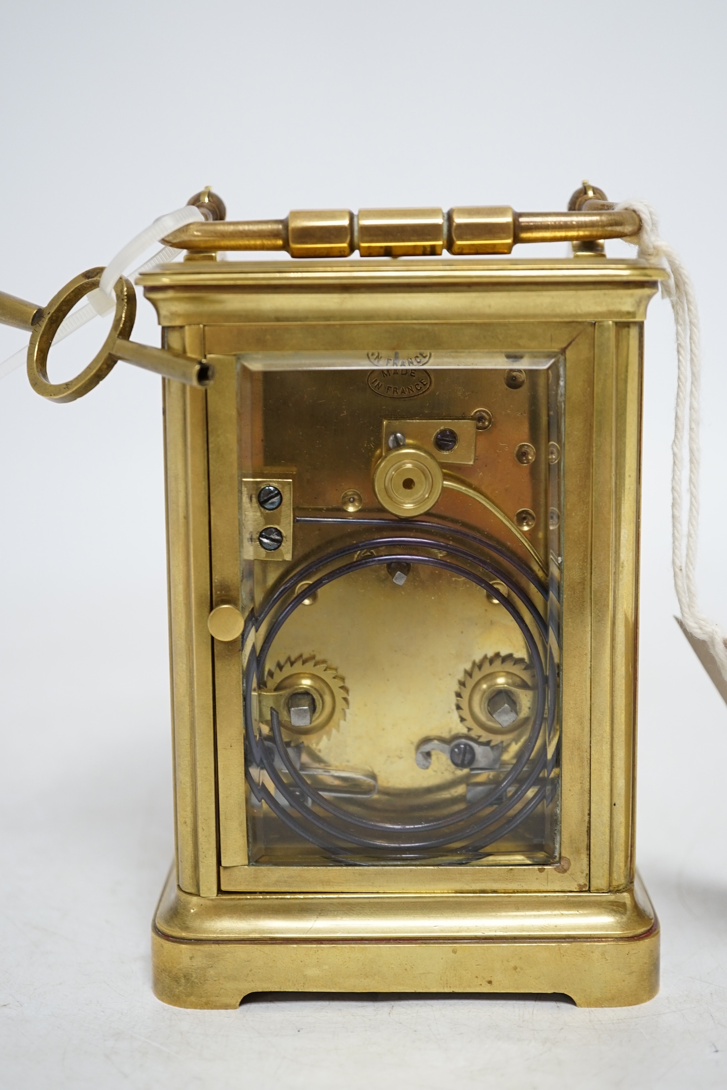 A brass cased repeating carriage clock with key, 14cm. Condition - good, currently ticking